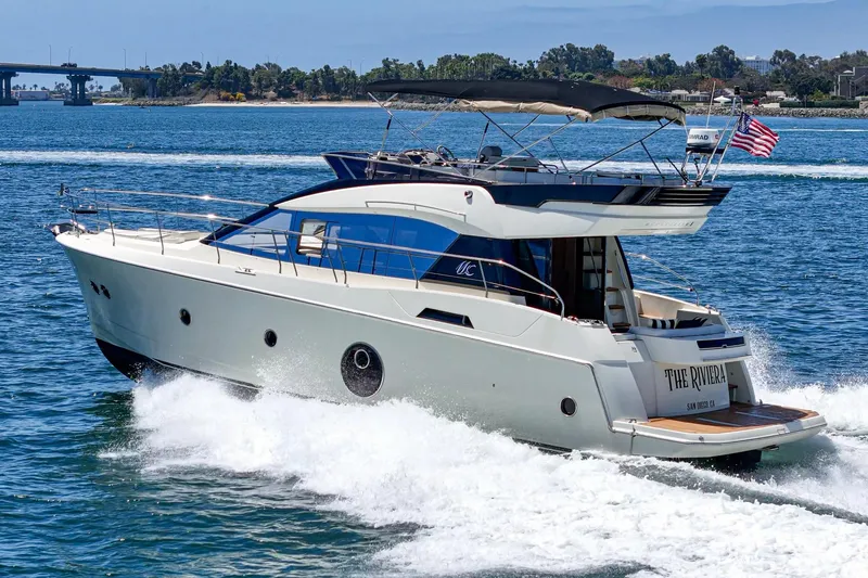 Slide: The Image of 2017 Monte Carlo MC5S yacht cruising on open water, displaying sleek design and luxury. - 5