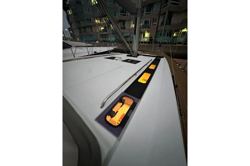 Slide: The Image of Beneteau Oceanis 55.1 yacht deck at night, illuminated windows, 2021 model. - 11