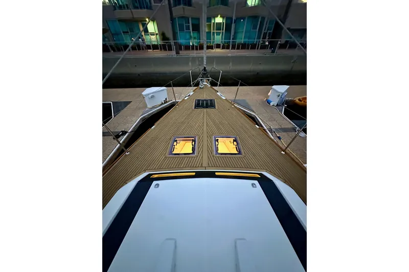 Slide: The Image of Beneteau Oceanis 55.1 yacht deck, 2021 model, docked at marina. - 12