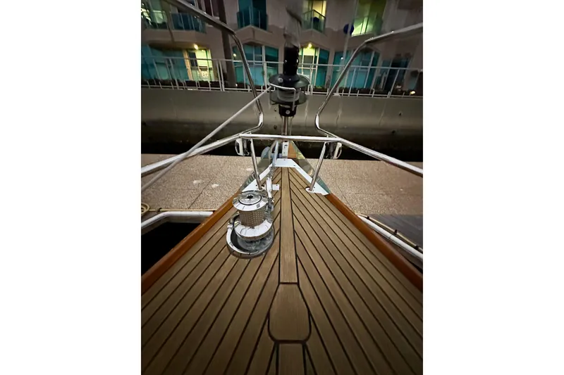 Slide: The Image of Bow view of 2021 Beneteau Oceanis 55.1 yacht with teak deck and winch. - 14