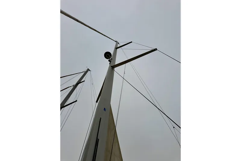 Slide: The Image of Mast of 2021 Beneteau Oceanis 55.1 sailboat against cloudy sky. - 18