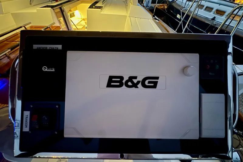Slide: The Image of B&G navigation system on a 2021 Beneteau Oceanis 55.1 yacht, illuminated at dusk. - 28