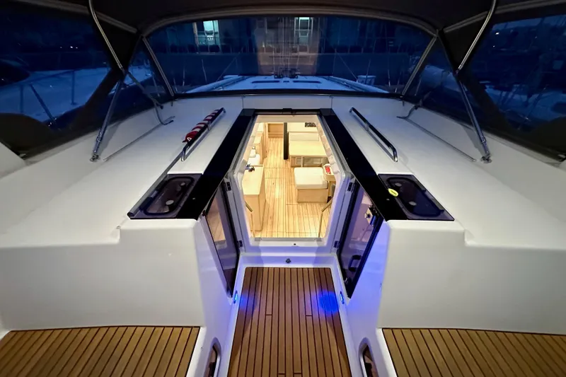 Slide: The Image of Beneteau Oceanis 55.1 yacht interior view, showcasing elegant wood flooring and modern design. - 33