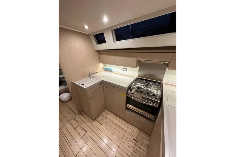 Slide: The Image of Modern kitchen interior of 2021 Beneteau Oceanis 55.1 yacht with sleek design and appliances. - 39