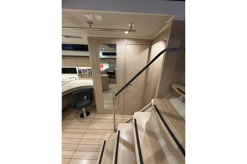 Slide: The Image of Interior of 2021 Beneteau Oceanis 55.1 yacht, featuring modern design and wooden finishes. - 49