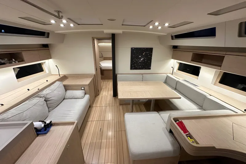 Slide: The Image of Luxurious interior of 2021 Beneteau Oceanis 55.1 yacht with modern seating and elegant design. - 61