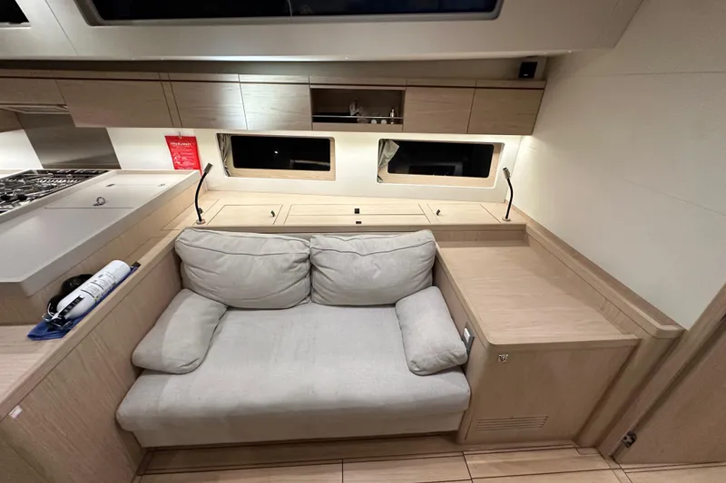 Slide: The Image of Interior of 2021 Beneteau Oceanis 55.1 yacht with cozy seating and modern design. - 63
