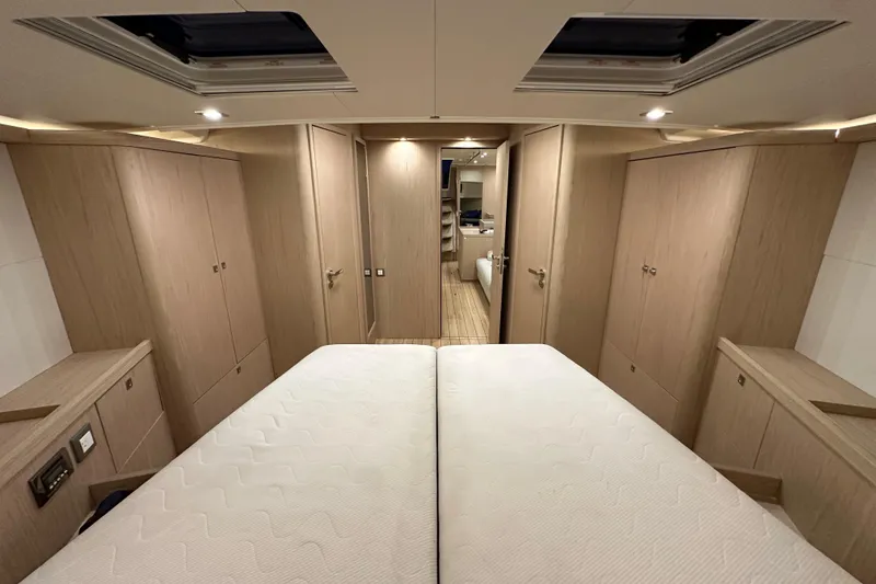 Slide: The Image of Luxurious interior of 2021 Beneteau Oceanis 55.1 yacht cabin with modern wood finish. - 75