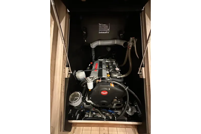 Slide: The Image of Engine compartment of 2021 Beneteau Oceanis 55.1 sailboat, showcasing mechanical components. - 80