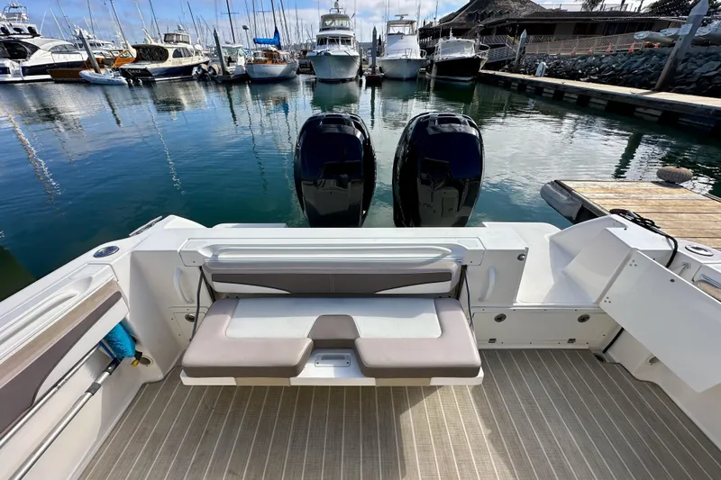 Slide: The Image of 2018 Wellcraft 290 Coastal boat with dual engines docked at a marina. - 15