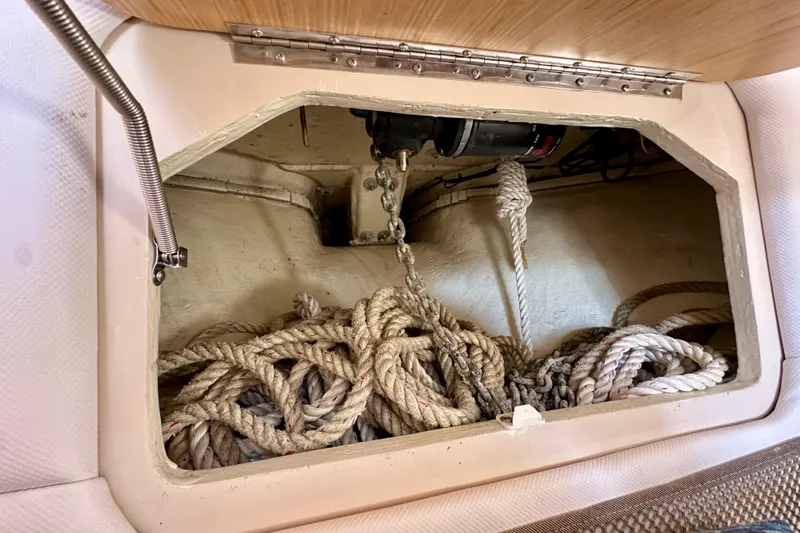 Slide: The Image of 2018 Wellcraft 290 Coastal boat storage compartment with coiled ropes and anchor chain. - 31