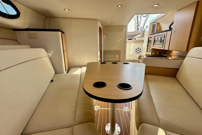 Slide: The Image of Interior of 2018 Wellcraft 290 Coastal boat with seating and kitchenette. - 33