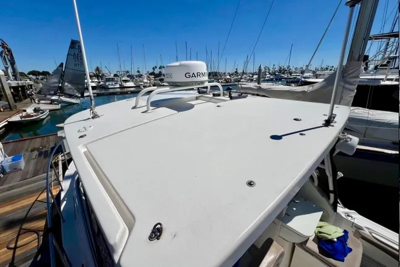 Slide: The Image of 2018 Wellcraft 290 Coastal boat docked at marina with Garmin radar. - 45
