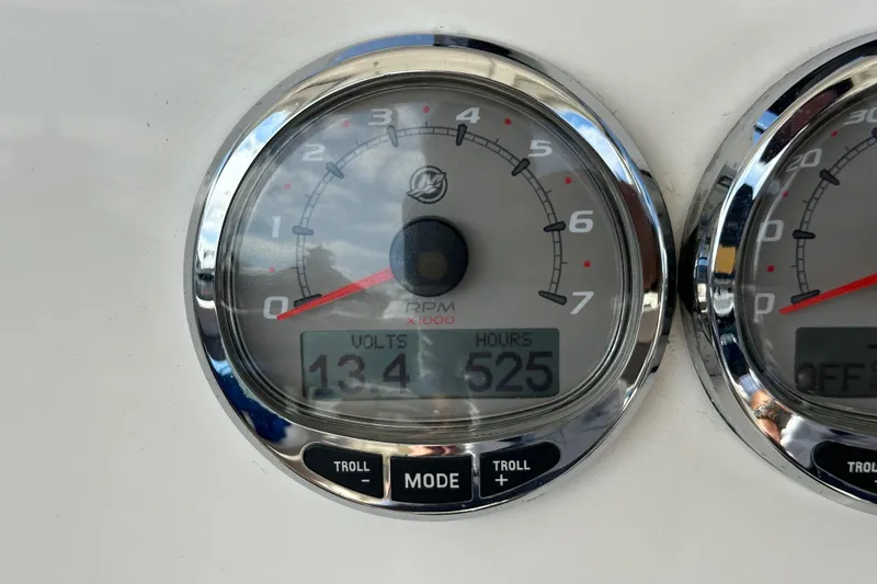 Slide: The Image of Close-up of Wellcraft 290 Coastal 2018 boat gauge showing 525 hours and 13.4 volts. - 52