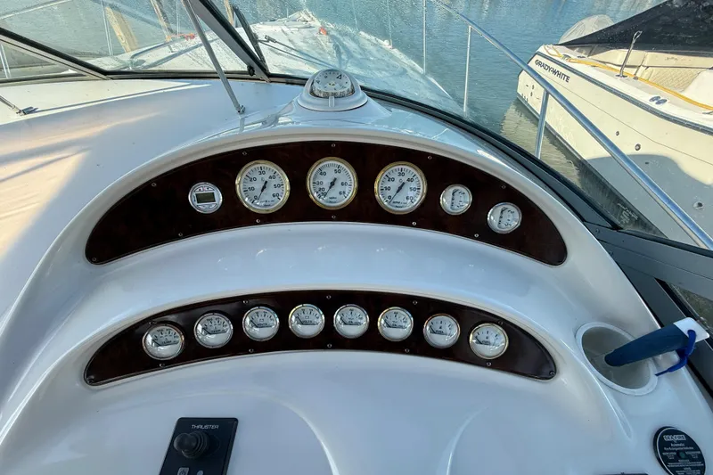 Slide: The Image of Dashboard of a 2000 Monterey 322 Cruiser boat with gauges and controls. - 19