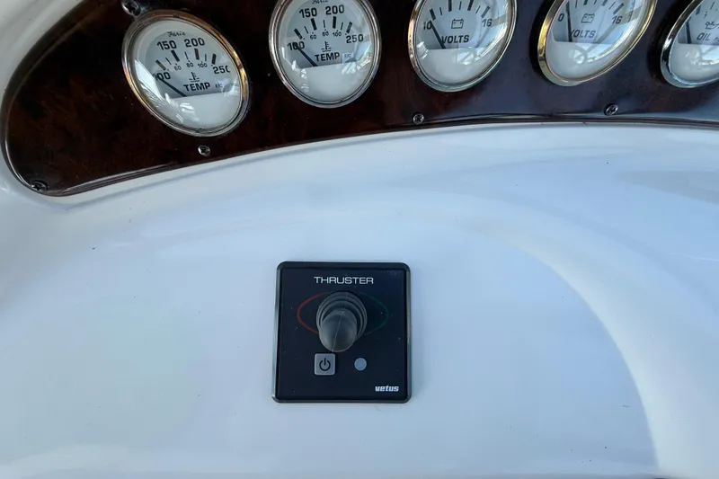 Slide: The Image of Control panel of a 2000 Monterey 322 Cruiser with gauges and thruster switch. - 20