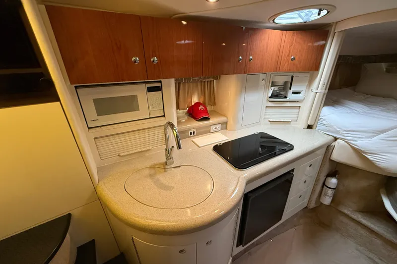 Slide: The Image of Interior of 2000 Monterey 322 Cruiser with kitchenette and sleeping area. - 25