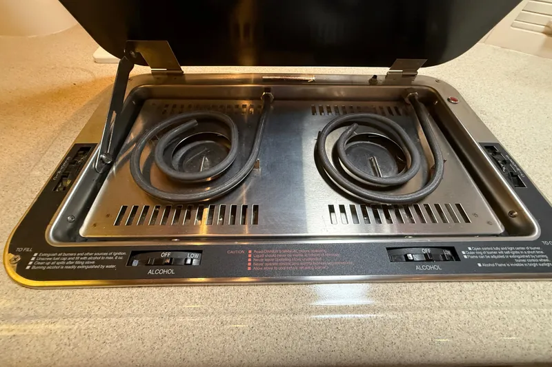 Slide: The Image of Stovetop on 2000 Monterey 322 Cruiser boat with dual alcohol burners. - 29