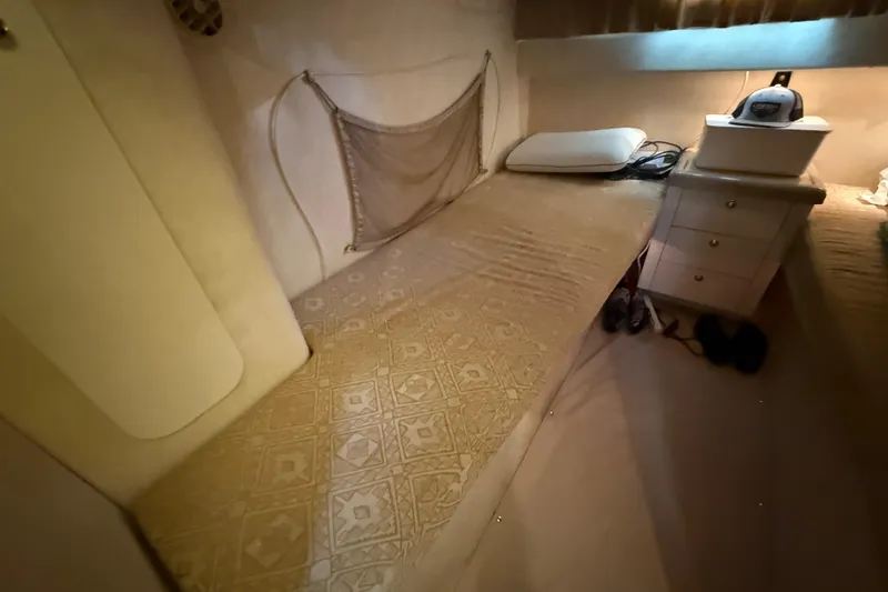 Slide: The Image of Interior cabin of 2000 Monterey 322 Cruiser with bed and storage. - 38