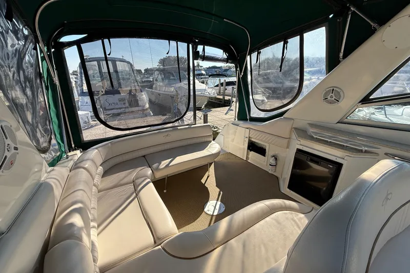 Slide: The Image of Interior of 2000 Monterey 322 Cruiser with beige seating and large windows. - 8
