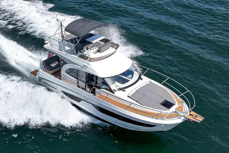 Slide: The Image of 2023 Beneteau Antares 11 Fly cruising on open water, showcasing sleek design and luxury features. - 13