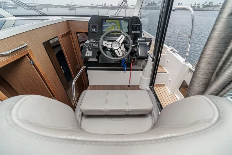 Slide: The Image of 2023 Beneteau Antares 11 Fly helm with modern controls and navigation system. - 45