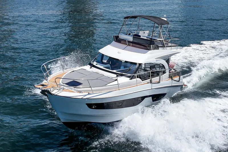 Slide: The Image of 2023 Beneteau Antares 11 Fly cruising on open water, showcasing sleek design and performance. - 5