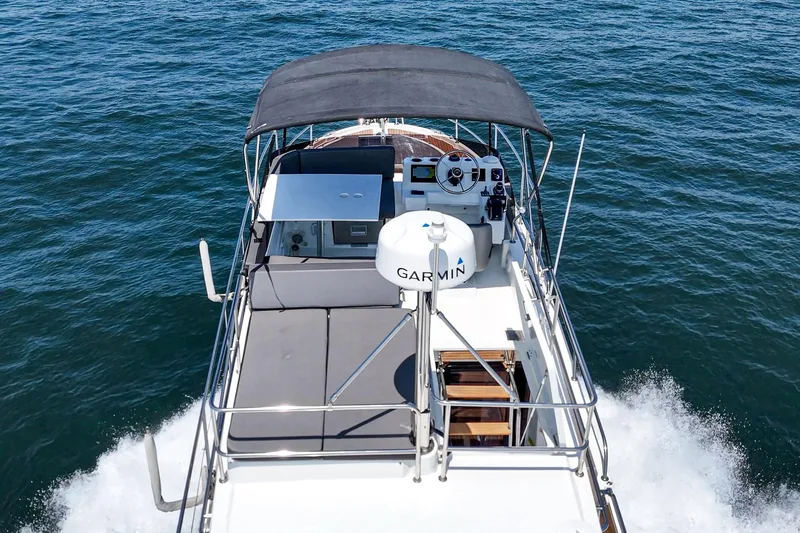 Slide: The Image of 2023 Beneteau Antares 11 Fly cruising on open water, top view. - 54