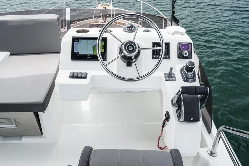 Slide: The Image of Helm of 2023 Beneteau Antares 11 Fly, featuring modern navigation and control systems. - 59