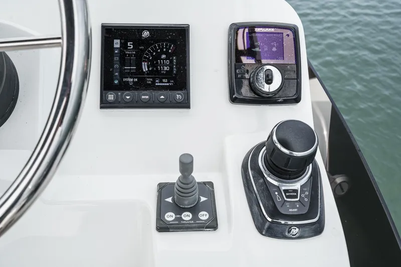 Slide: The Image of Control panel of 2023 Beneteau Antares 11 Fly with navigation instruments and joystick. - 61