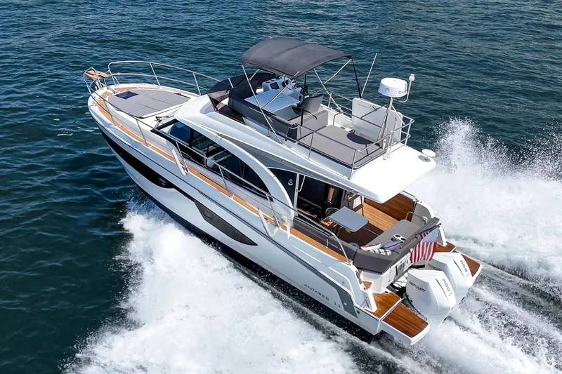 Slide: The Image of 2023 Beneteau Antares 11 Fly cruising on open water, showcasing sleek design and powerful engines. - 8