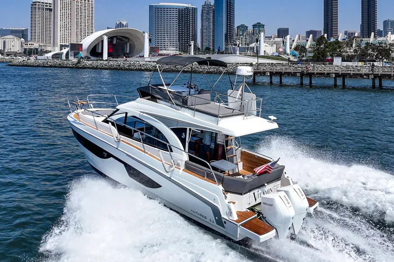 Slide: The Image of 2023 Beneteau Antares 11 Fly cruising near city skyline and waterfront. - 9