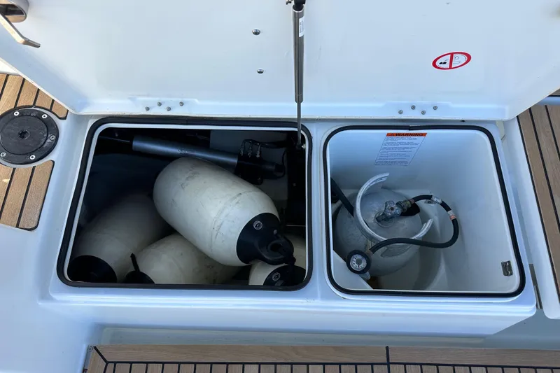 Slide: The Image of Storage compartments on a 2022 Jeanneau Sun Odyssey 410 sailboat deck. - 100