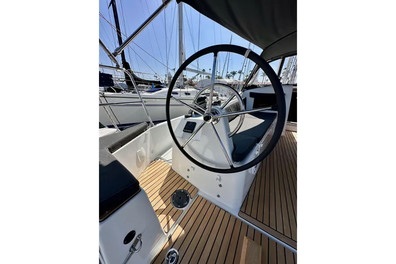 Slide: The Image of Steering wheel of 2022 Jeanneau Sun Odyssey 410 sailboat with teak deck. - 11