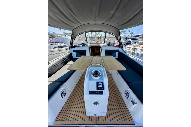 Slide: The Image of 2022 Jeanneau Sun Odyssey 410 yacht cockpit with seating, table, and navigation equipment. - 14