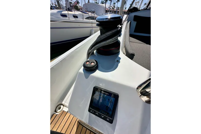 Slide: The Image of Jeanneau Sun Odyssey 410 sailboat deck with winch and navigation display, 2022 model. - 16