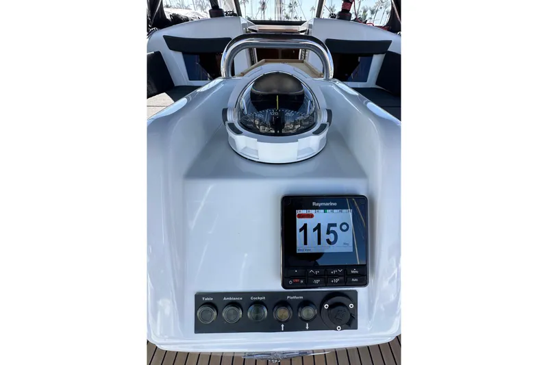 Slide: The Image of Cockpit controls of 2022 Jeanneau Sun Odyssey 410 sailboat with compass and Raymarine display. - 17