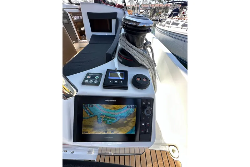 Slide: The Image of Cockpit of 2022 Jeanneau Sun Odyssey 410 with navigation equipment and winch. - 19