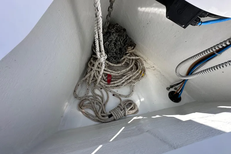 Slide: The Image of Anchor locker of 2022 Jeanneau Sun Odyssey 410 with ropes and cables. - 26