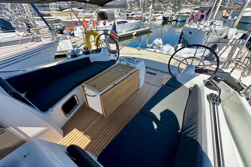 Slide: The Image of Jeanneau Sun Odyssey 410, 2022 model, featuring a spacious cockpit with elegant seating. - 31