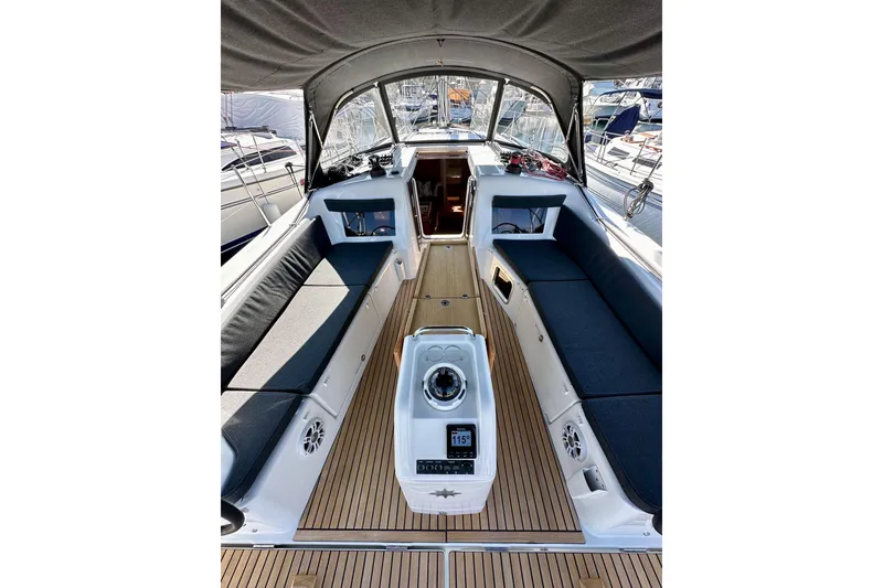 Slide: The Image of 2022 Jeanneau Sun Odyssey 410 yacht cockpit with sleek seating and modern navigation equipment. - 32