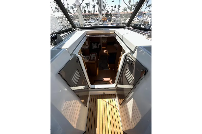 Slide: The Image of Interior view of 2022 Jeanneau Sun Odyssey 410 sailboat, showcasing cabin entrance and deck. - 36
