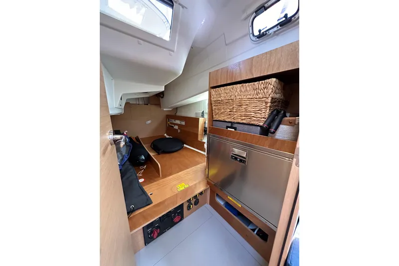 Slide: The Image of Interior of 2022 Jeanneau Sun Odyssey 410 sailboat, featuring storage and compact design. - 42