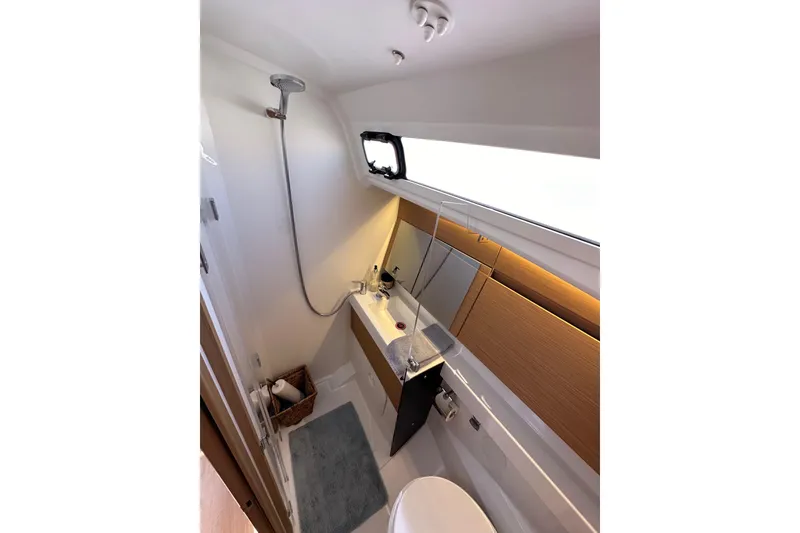 Slide: The Image of Modern bathroom in 2022 Jeanneau Sun Odyssey 410 yacht, featuring sleek design and compact layout. - 46
