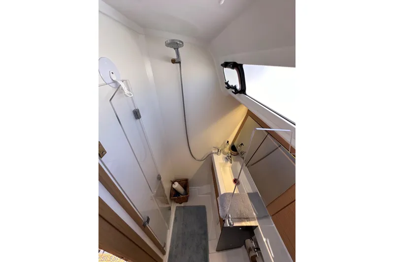 Slide: The Image of Modern bathroom interior of 2022 Jeanneau Sun Odyssey 410 yacht, featuring shower and sink. - 47