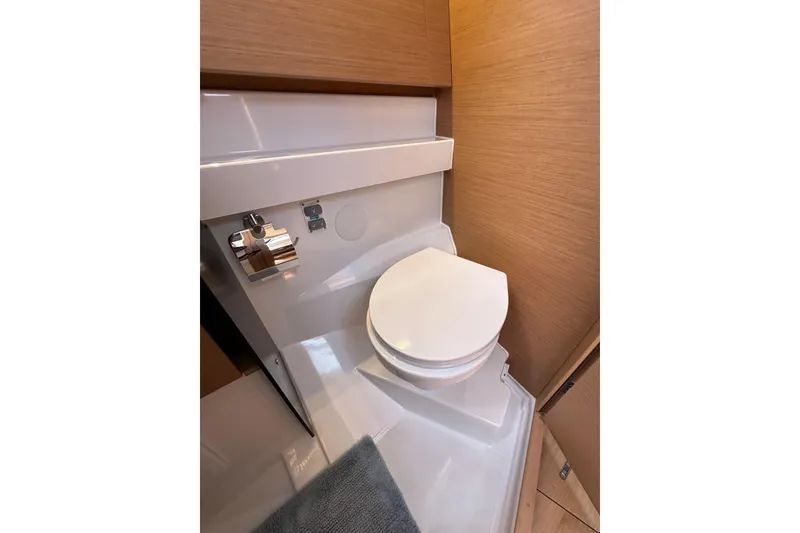 Slide: The Image of Modern bathroom in 2022 Jeanneau Sun Odyssey 410 yacht, featuring sleek design and wood accents. - 48