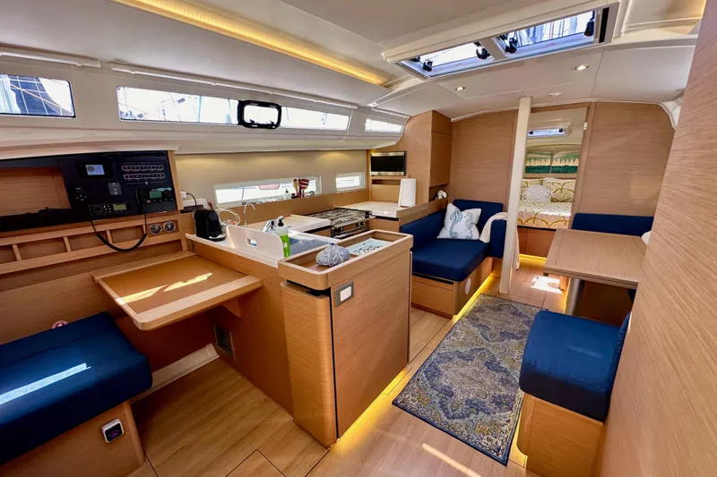 Slide: The Image of Interior of 2022 Jeanneau Sun Odyssey 410 sailboat, featuring modern design and cozy seating. - 53