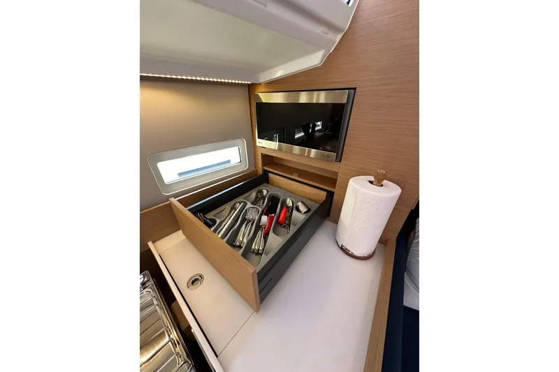 Slide: The Image of Interior of 2022 Jeanneau Sun Odyssey 410 yacht with cutlery drawer and paper towel holder. - 64