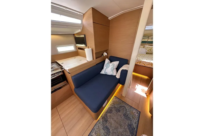 Slide: The Image of Interior of 2022 Jeanneau Sun Odyssey 410 yacht with cozy seating and modern design. - 65