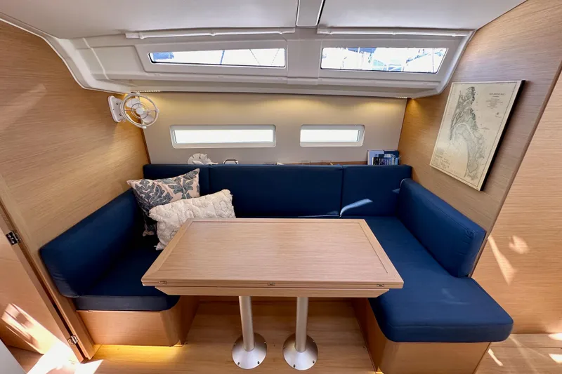 Slide: The Image of Interior of 2022 Jeanneau Sun Odyssey 410 with cozy seating and nautical decor. - 73